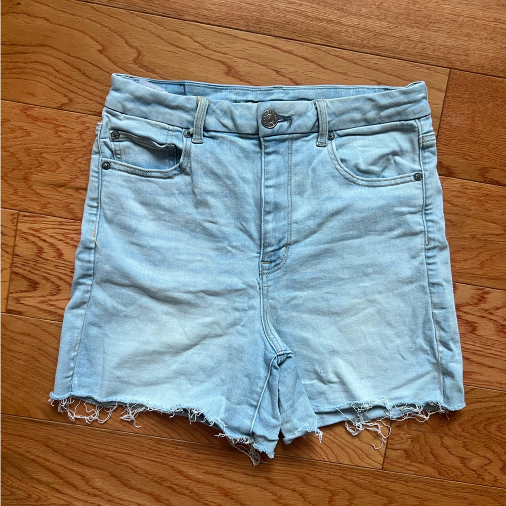 American Eagle light wash denim shorts women’s size 12 high rise distressed hem